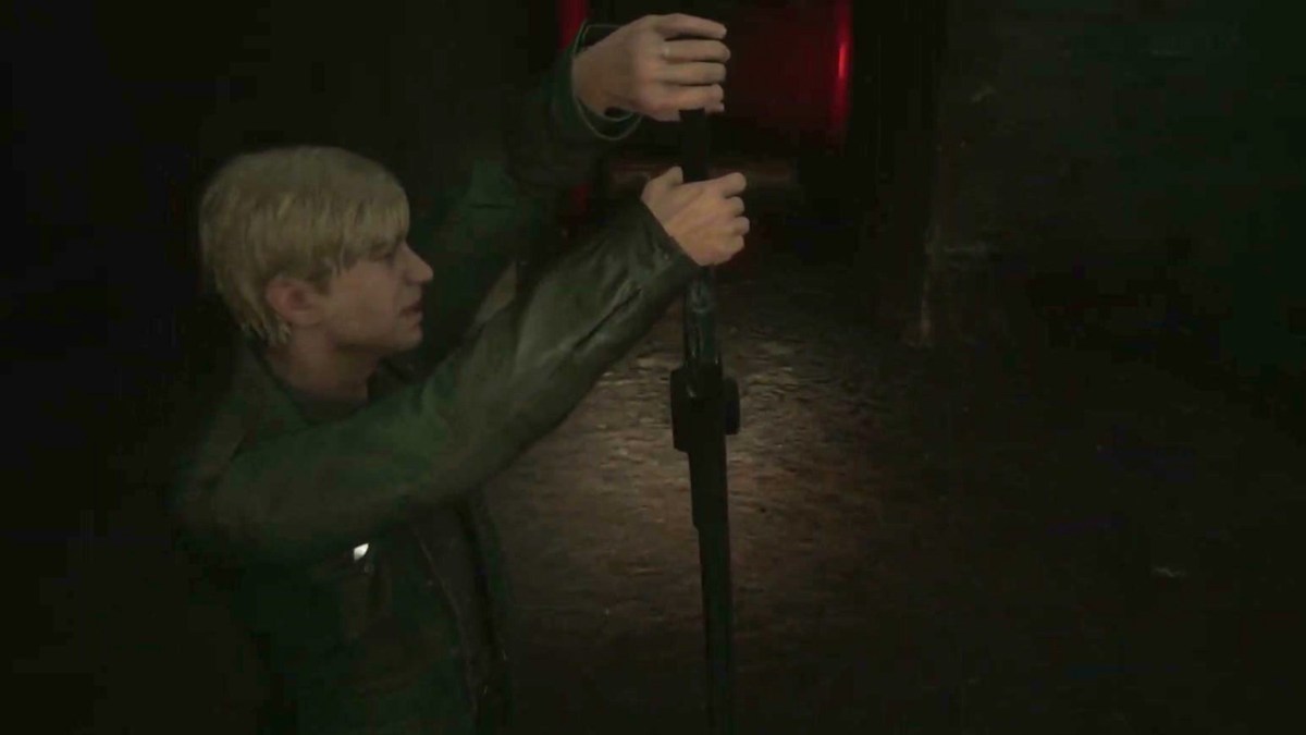 Silent Hill 2, James récupérant le grand couteau de Pyramid Head. 